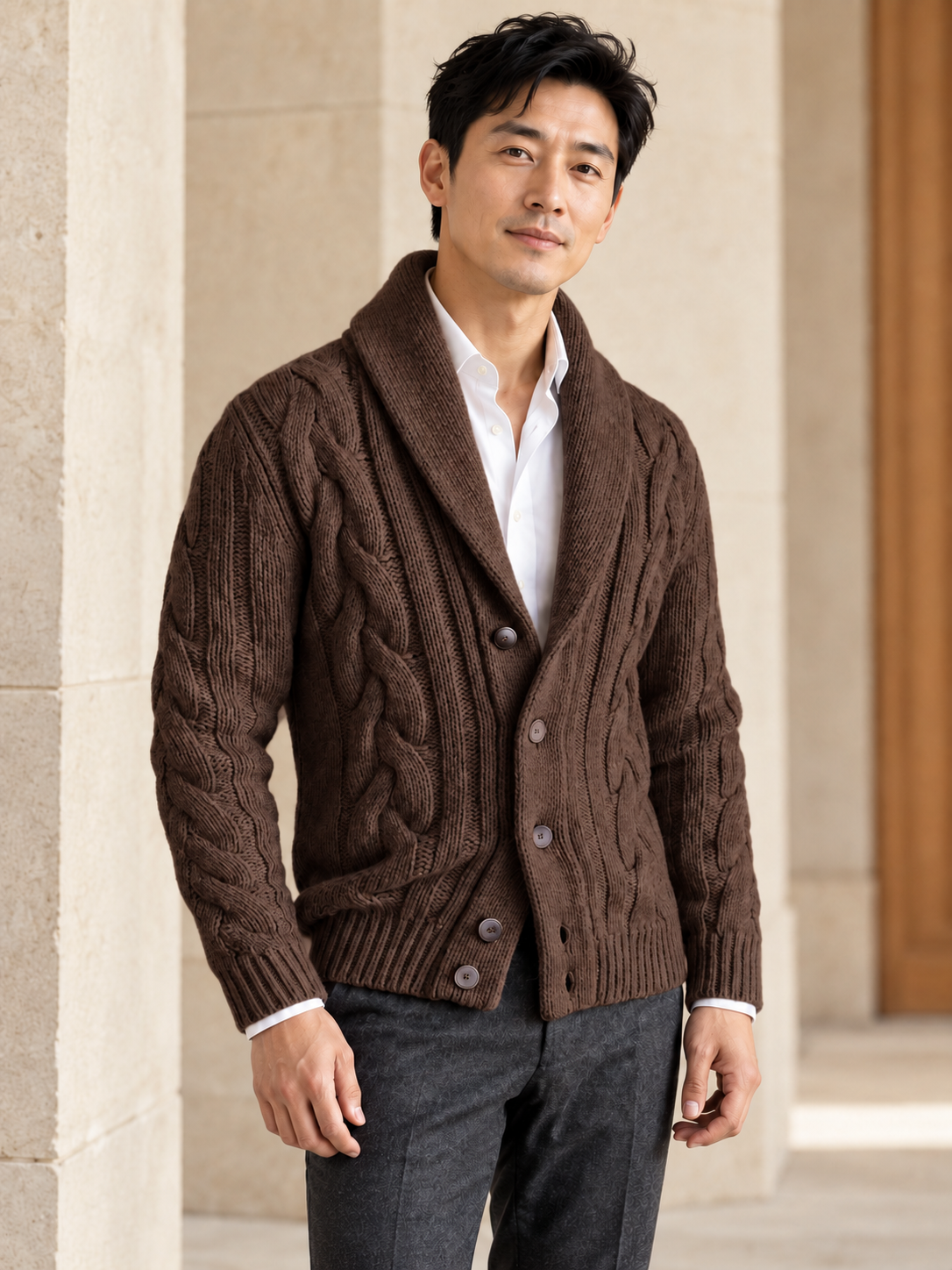 Male model wearing brown cable-knit shawl-collar cardigan