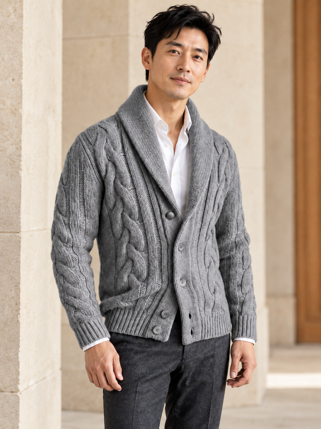 Male model wearing gray cable-knit shawl-collar cardigan