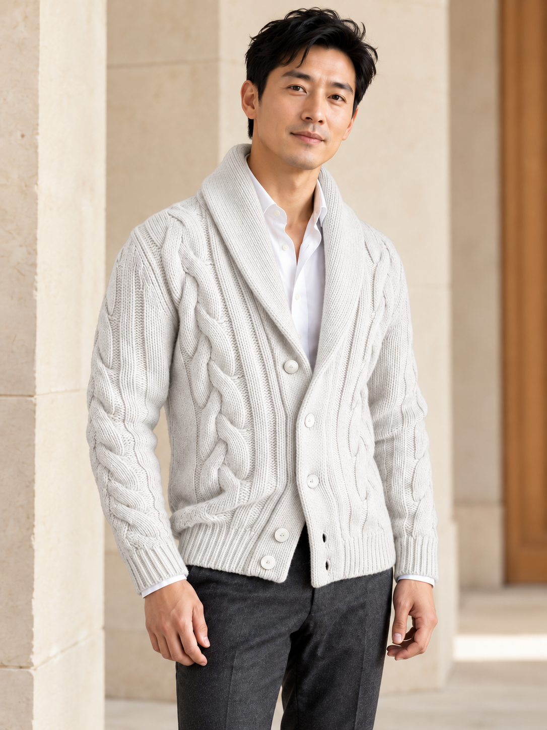 Male model wearing white cable-knit shawl-collar cardigan