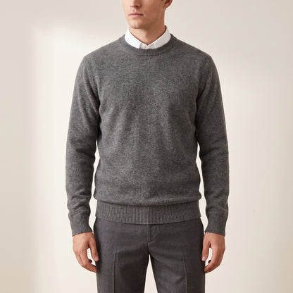 Men's grey crew-neck knit sweater worn by a model