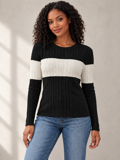 front view of female model wearing black knit top with ivory contrast band