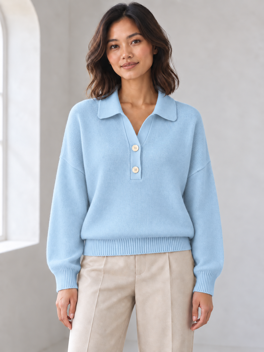 Women's sky blue half-button polo sweater on model