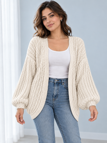 Female model wearing ivory open-front lantern-sleeve cardigan, front view