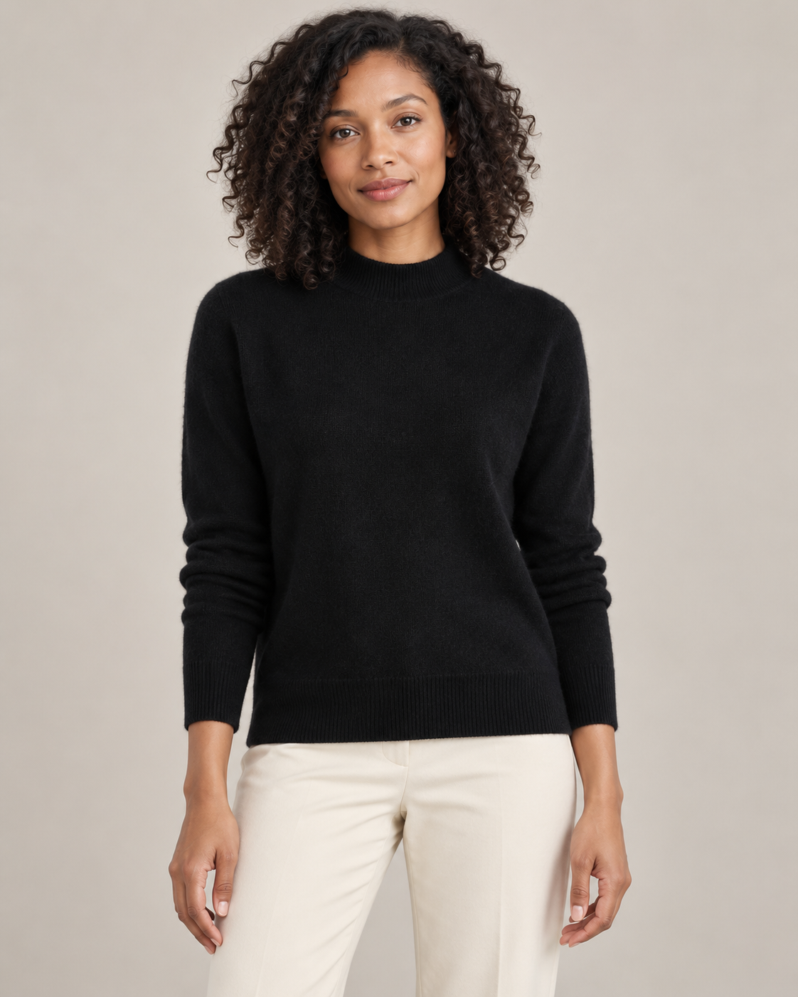 Black mock-neck sweater on a model