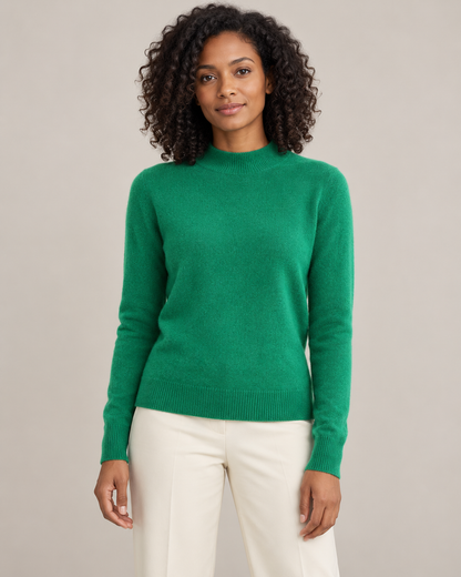 Emerald green mock-neck sweater on a model