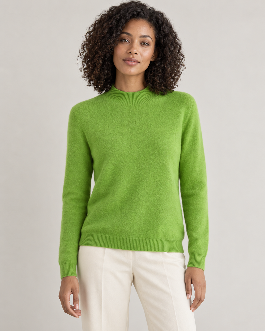 Lime green mock-neck sweater on a model