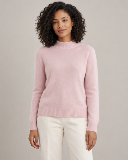 Blush pink mock-neck sweater on a model