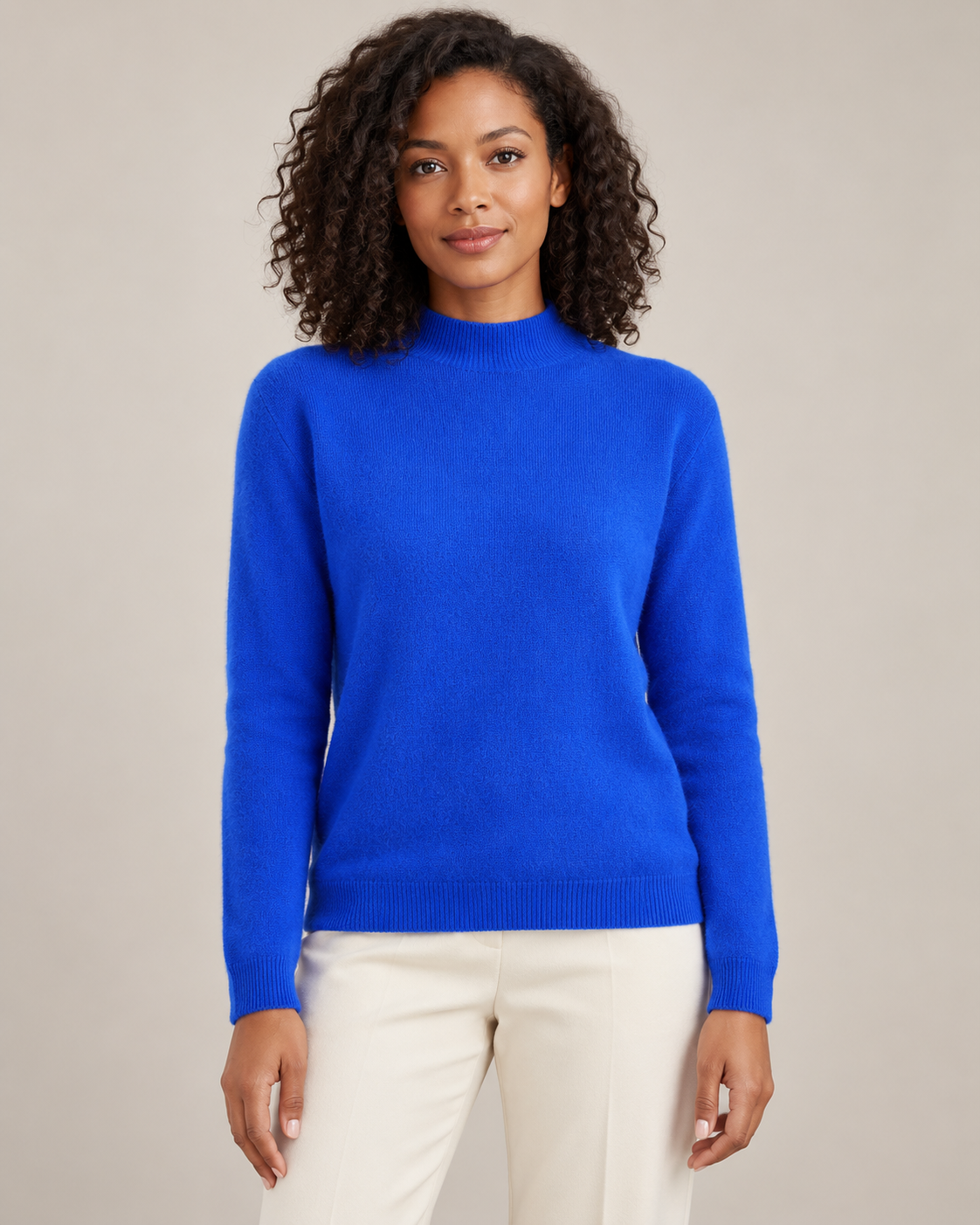 Royal blue mock-neck sweater on a model