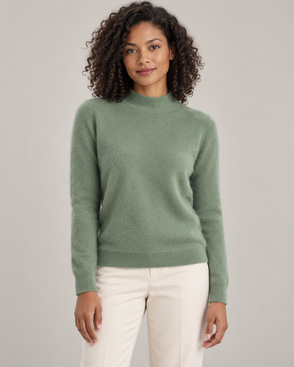 Sage green mock-neck sweater on a model