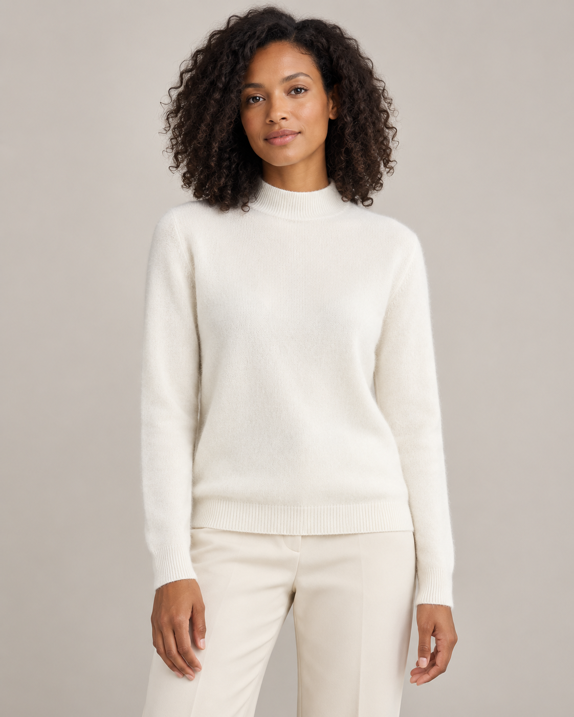 Ivory white mock-neck sweater on a model
